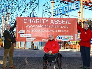 Rick Clement next to the Big One rollercoaster