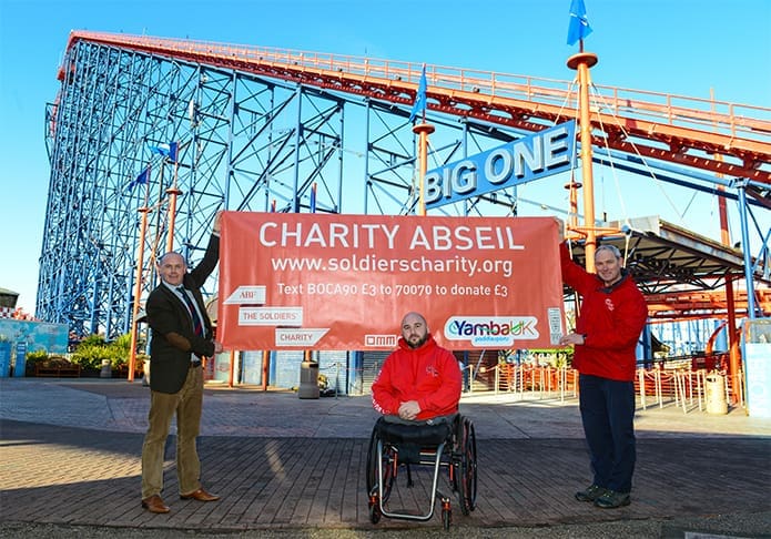 Rick Clement next to the Big One rollercoaster