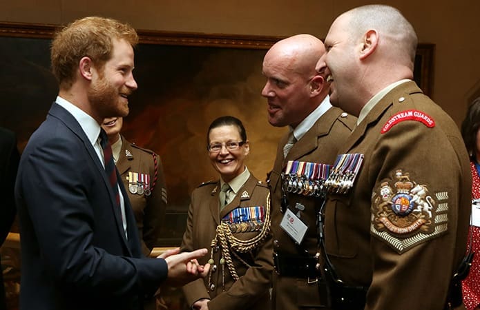 HRH Prince Harry talks to WO1 (GSM) Andrew 'Vern' Stokes,Garrison Sergeant Major, London District and WO1 Glenn Haughton, trustee of ABF The Soldiers' Charity