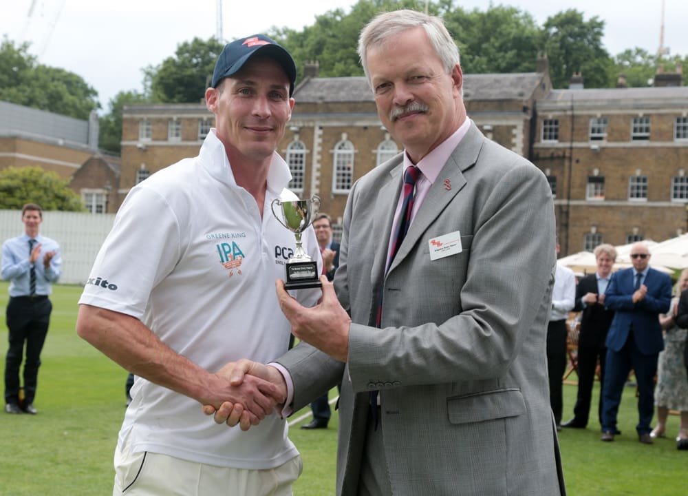 Simon Jones receives the City Invitational Cup from Robin Bacon, ABF The Soldiers' Charity