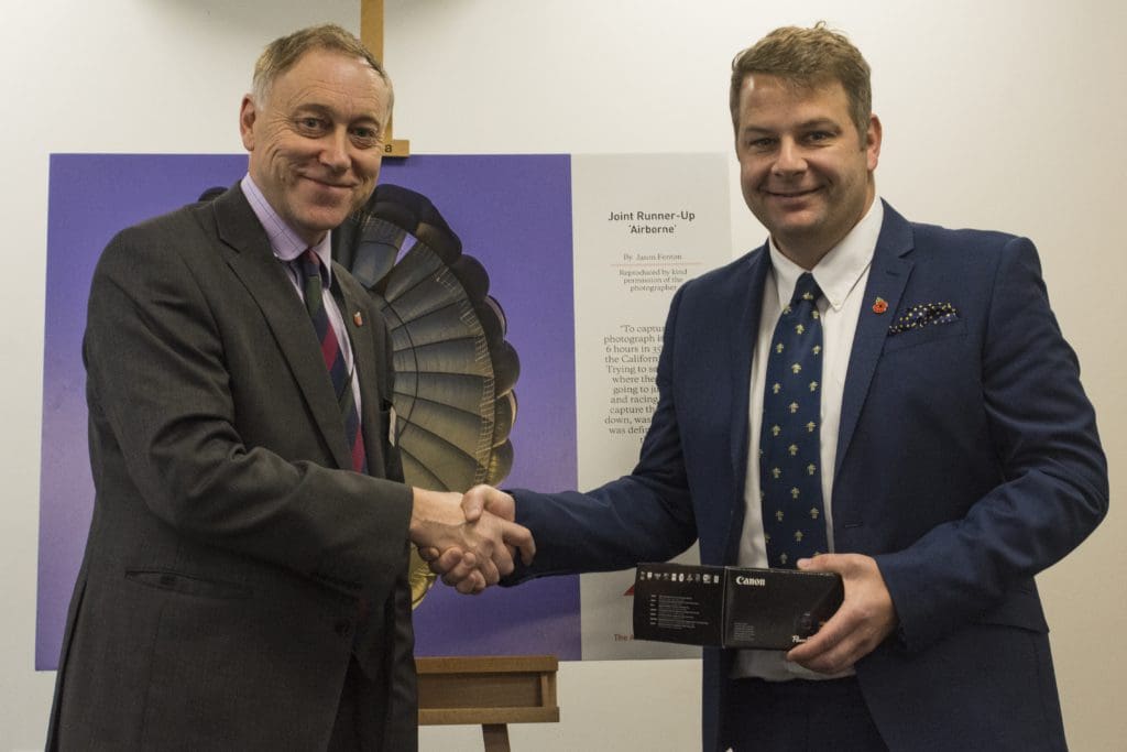 Jason Fenton receives his prize from Col (Ret'd) Barney Haugh CBE